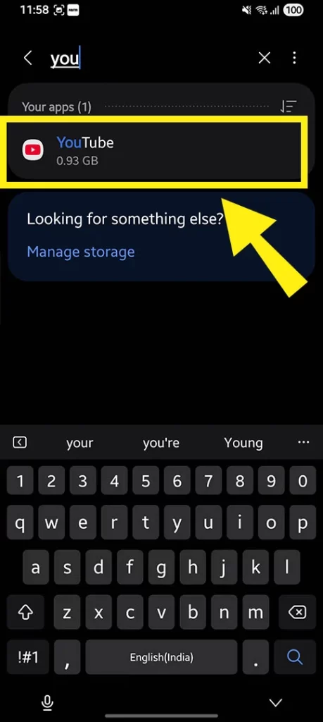 Smartphone settings interface showing the next step to clear cache, with a yellow box and arrow pointing to the storage or app details section at the bottom.